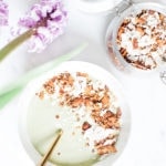 Pistachio ice cream smoothie bowl with coconut buckwheat granola from above.