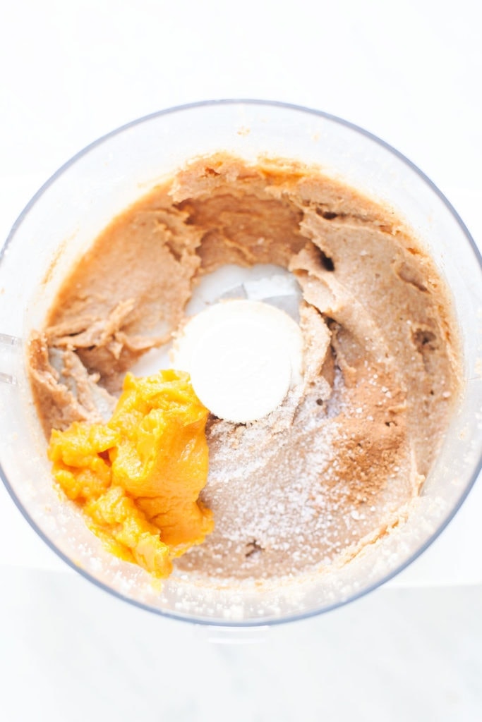 Pumpkin truffles ingredients in a food processor.