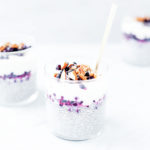 Blueberry pie chia puddings layered with yogurt and blueberries in glasses.