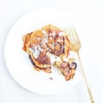 Pumpkin pancakes on a white plate.