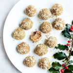 Gingerbread energy bites on a white plate.