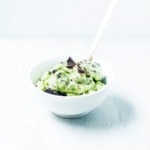 Matcha mint chocolate chip nice cream in a white bowl.