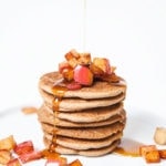 Stack of gluten-free apple cinnamon pancakes with apple topping.