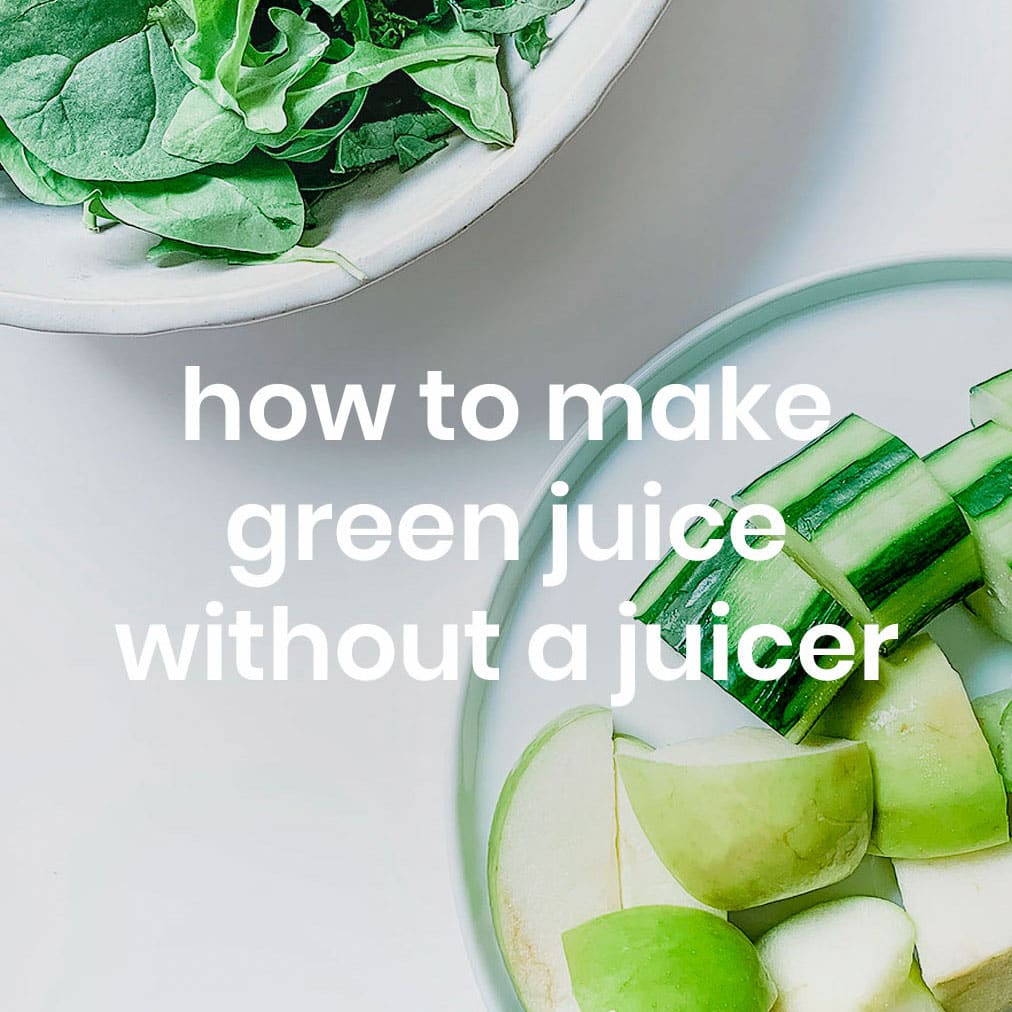 Green juice ingredients on a white table.
