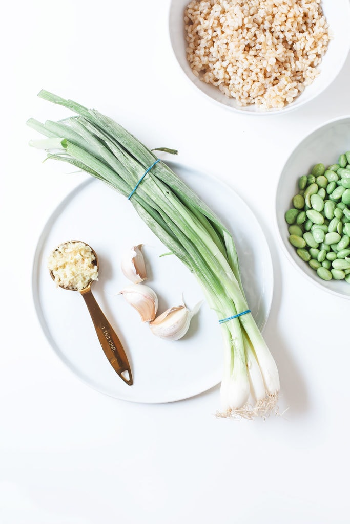 Peanut edamame burger ingredients on a white plate.