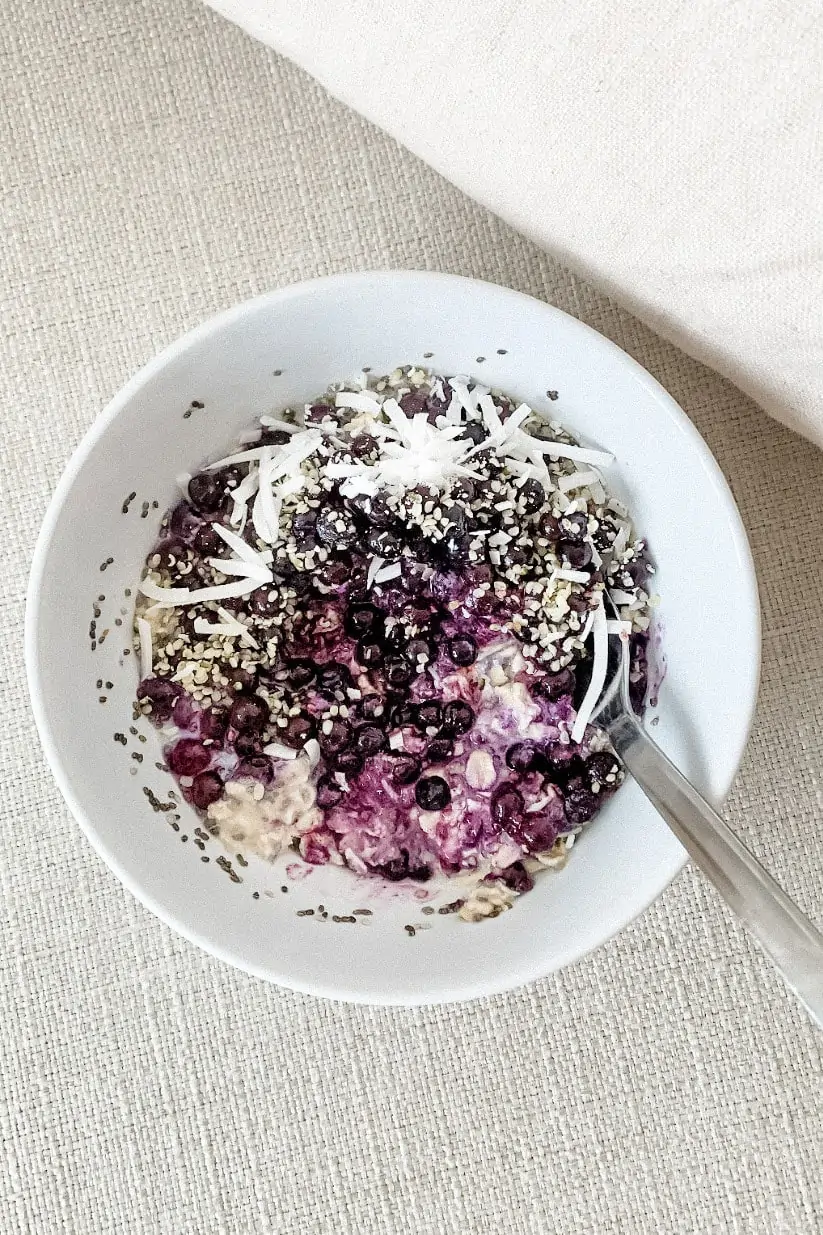 Blueberry overnight oats in a white bowl